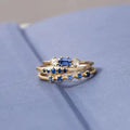 Layered ring with blue zircon