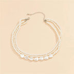 White Stone and Pearl Necklace in Gold