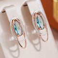 Elegant earrings with turquoise crystals in gold and silver