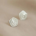 Vintage earrings in the shape of a white flower
