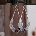 Vintage dangling earrings with red crystals