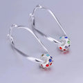 Multicolored earrings with beads in shining silver