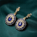 Vintage gold earrings with blue mandala crystal