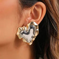 Heart earrings made of gold and silver