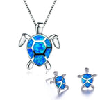 Set of necklace and earrings with opal sea turtles